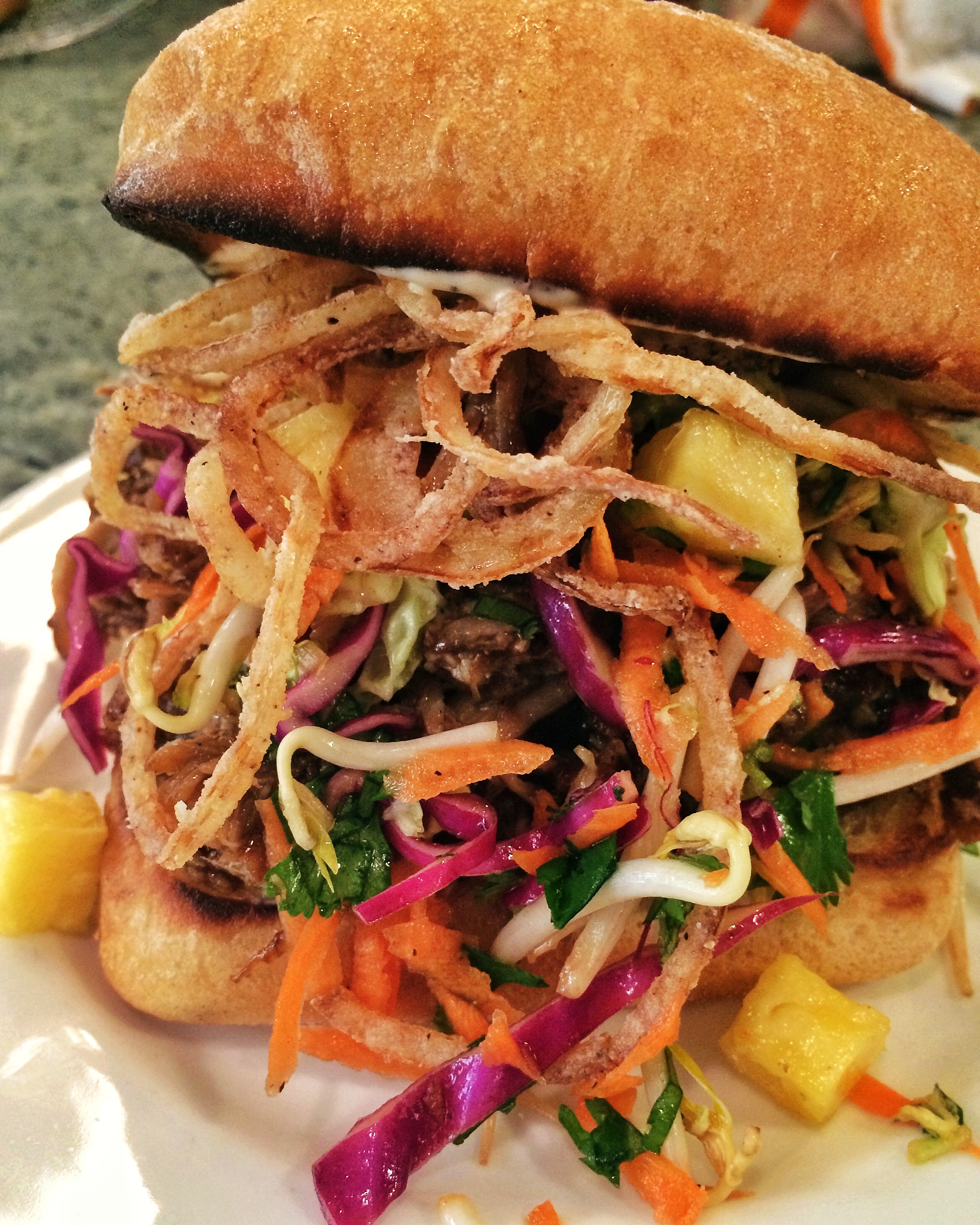 Kalua Pork Sandwich with Kimchee Aioli, Pineapple Asian Slaw and Crispy
